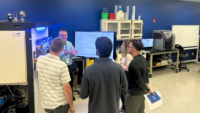 training A group of participants looking at data from a Hull LyoStar at Hands-On Freeze-Drying Training.